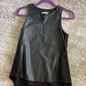 Pleather and fabric tunic top. Small, but fits a small medium sized woman.